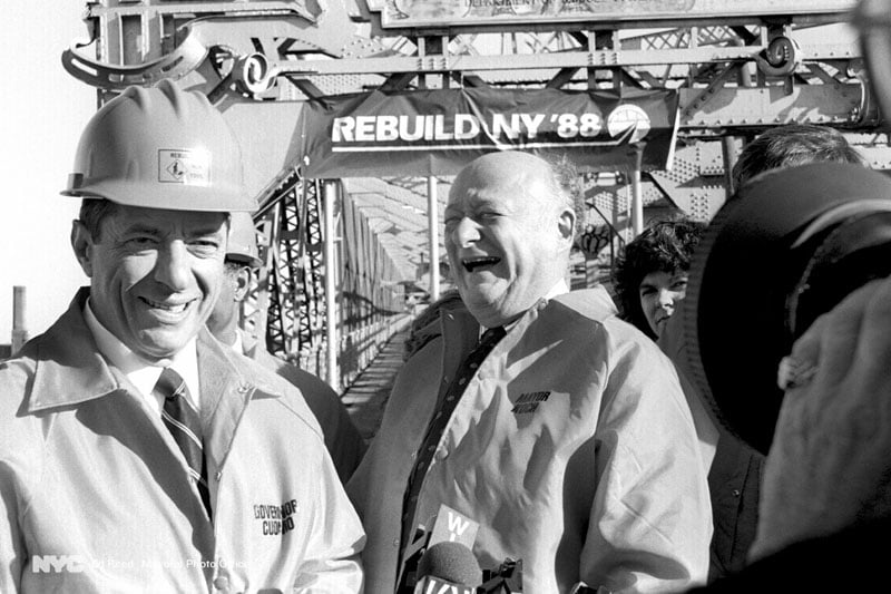 November 3, 1988. Governor Mario Cuomo and Ed Koch on the Williamsburg Bridge discussing transportation infrastructure.