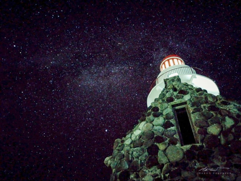 Naidi Lighthouse and the dimmer section of the Milky Way.