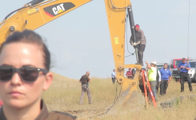 "Happy" American Horse from the Sicangu Nation locks himself to construction equipment in protest of the Dakota Access Pipeline.