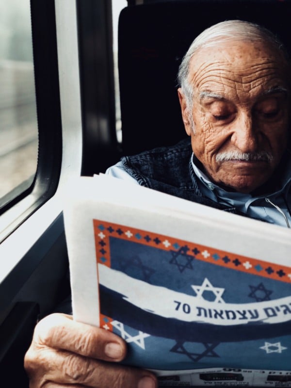 The old man reading the newspaper