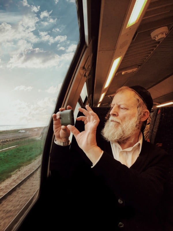 I thought grandpa was taking pictures of the scenery outside the train with his mobile phone