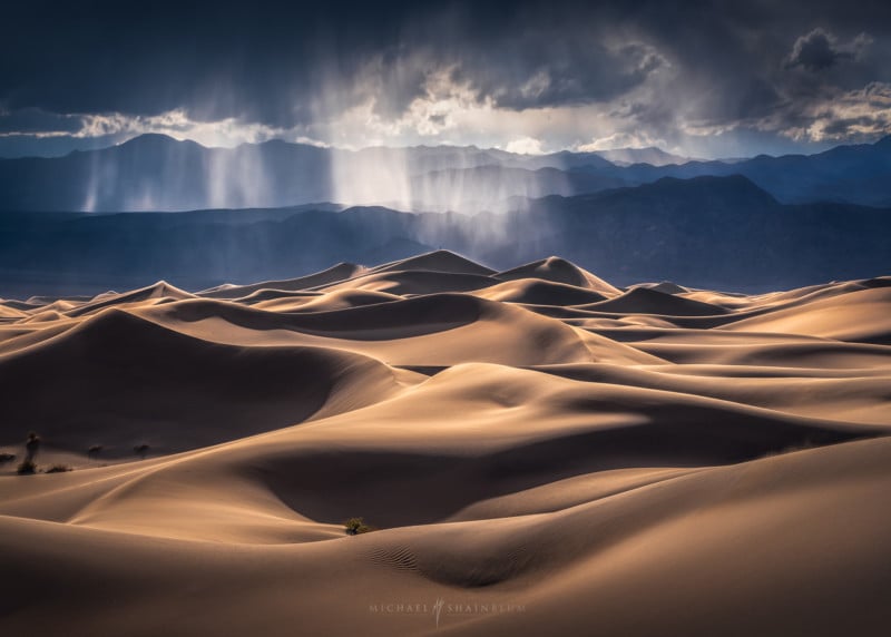 Single Sand Dune In The Desert Against Clear Blue Sky Stock Photo