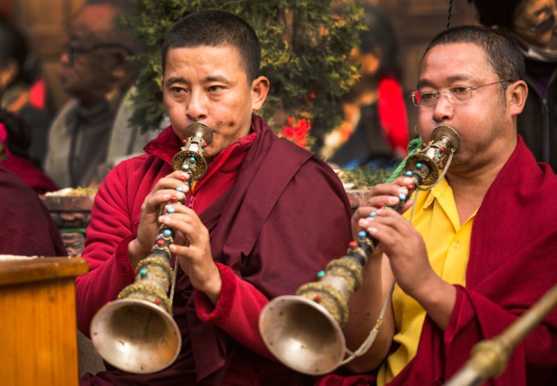 KHATMANDU, NEPAL - DEC 17, 2013: Unidentified tibetan Buddhist monks near stupa Boudhanath during festive Puja of H.H. Drubwang Padma Norbu Rinpoche's reincarnation's.