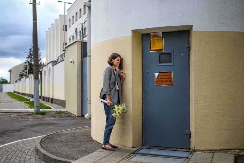 Title: Waiting for Release at a Temporary Detention Center in Belarus © Nadia Buzhan Caption: Olga Sieviaryniec waits for her husband Paval outside a detention center on Akrestsin Street, Minsk, Belarus, on 22 July 2020. Story: Paval Sieviaryniec had been held on remand since 7 June, and his family had learned he was about to be released. Olga waited outside the prison for two hours, but Paval was not freed. Paval Sieviaryniec is a Christian Democrat politician and a well-known political activist. He is one of the founders of Youth Front, a youth movement supporting civil society based on Christian-democratic principles and the free market, and the education of young people to revive Belarusian national culture and language. He was arrested while collecting signatures in support of candidates to stand against President Alexander Lukashenko in his bid for a sixth consecutive term in office. Lukashenko had been in power since 1994. Dubbed ‘Europe’s last dictator by media outlets, he had frequently repressed opposition, and had not had a serious challenge to his leadership in the previous five elections. Amnesty International considers Paval Sieviaryniec a prisoner of conscience. He was still in prison in early 2021, partly in solitary confinement and unable to meet with a lawyer. He was denied access to books and television, and his Bible was taken from him.