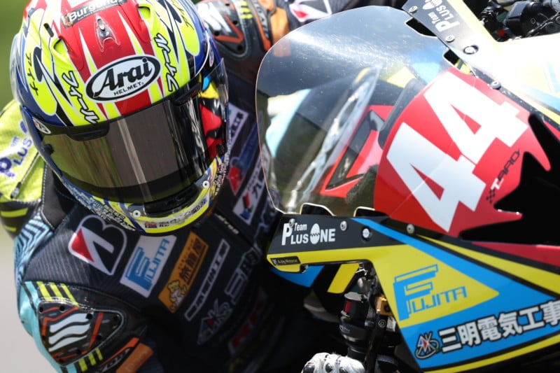 Close up of a motorcyclist's helmet as he turns a corner