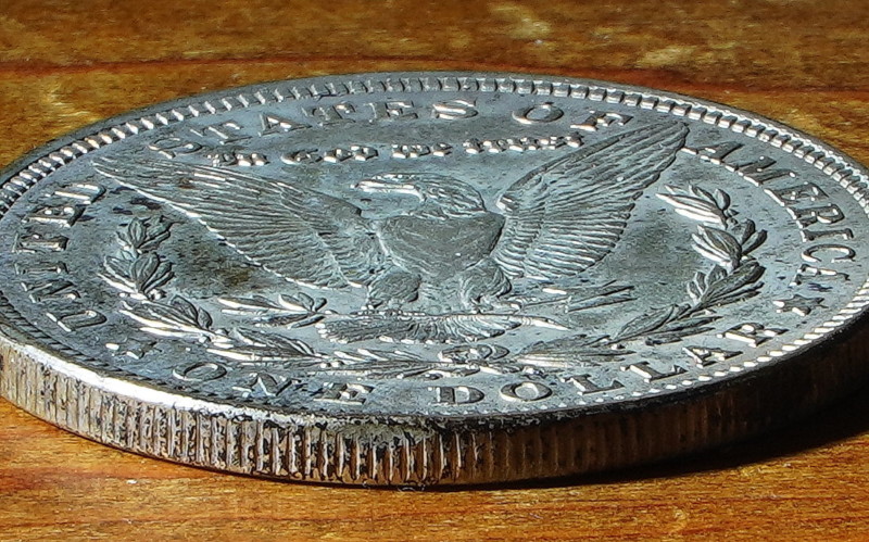 A macro photo of a coin on a table