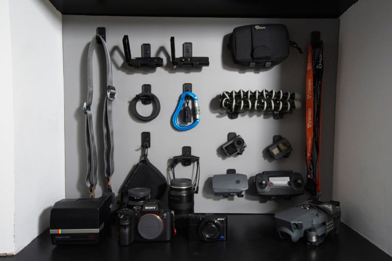 Hooks holding a variety of camera equipment