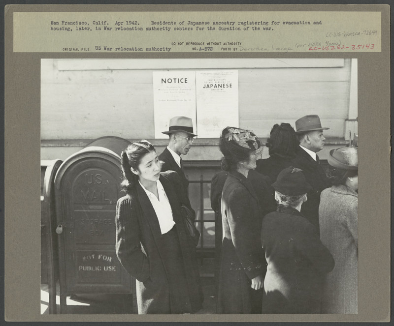 San Francisco, Calif., Apr. 1942 – residents of Japanese ancestry registering for evacuation and housing, later, in War Relocation Authority centers for duration of the war. Photo by Dorothea Lange, 1942.