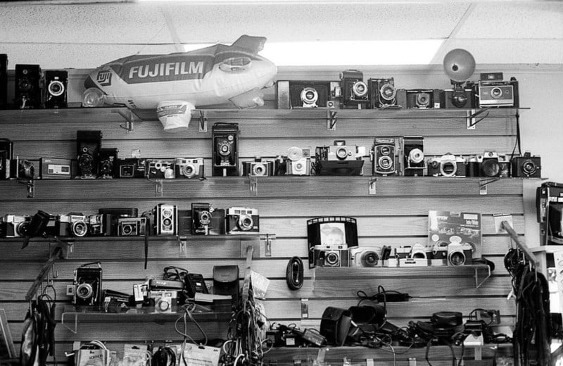 Vintage cameras on the wall of a camera repair store