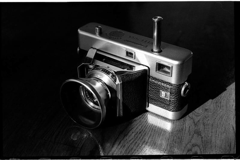 A vintage camera on a wooden surface