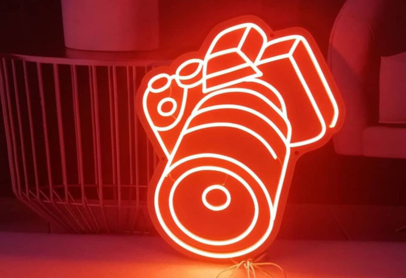 A faux neon light in the shape of a camera