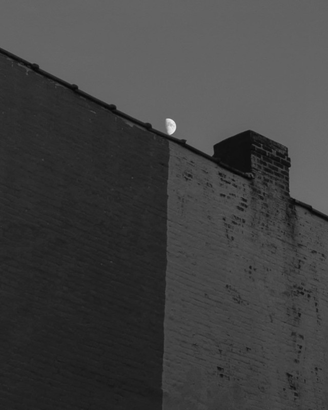 A moon above a wall