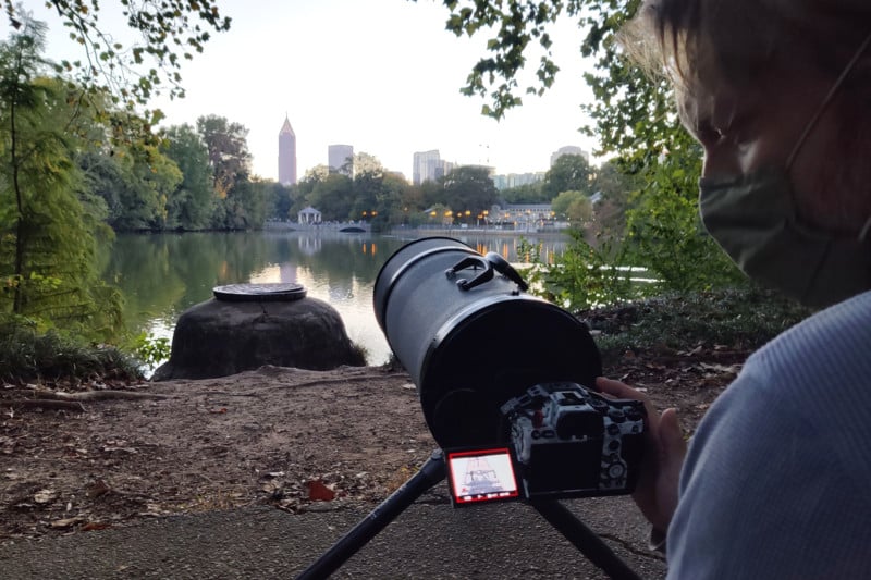 The Nikon 1000mm reflex lens pointed at a subject in the distance.