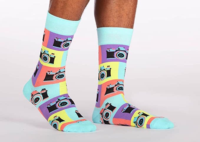 Colorful socks with vintage cameras as the pattern