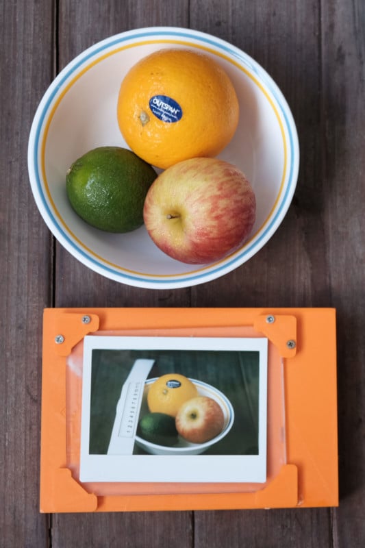 3D printed ground glass back next to a bowl of fruit.