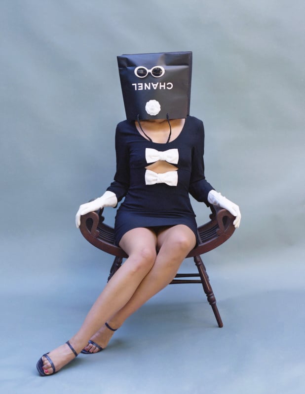 A woman wearing a paper bag on her head