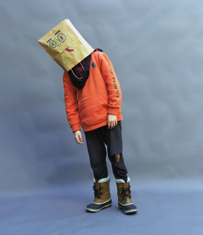 A person wearing a paper bag on their head