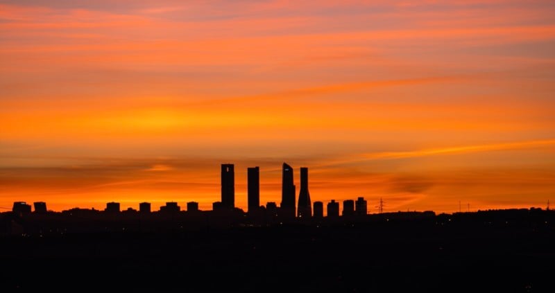A sunset photo of the Four Towers of Madrid