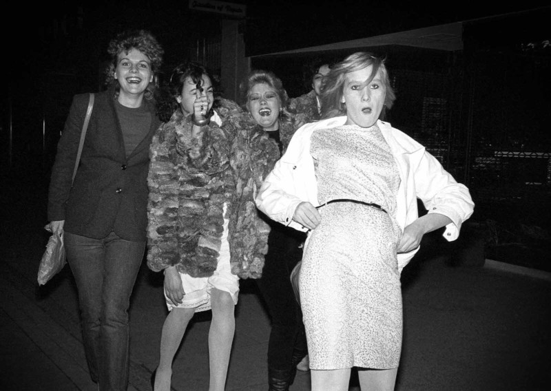 A group of young ladies on a street