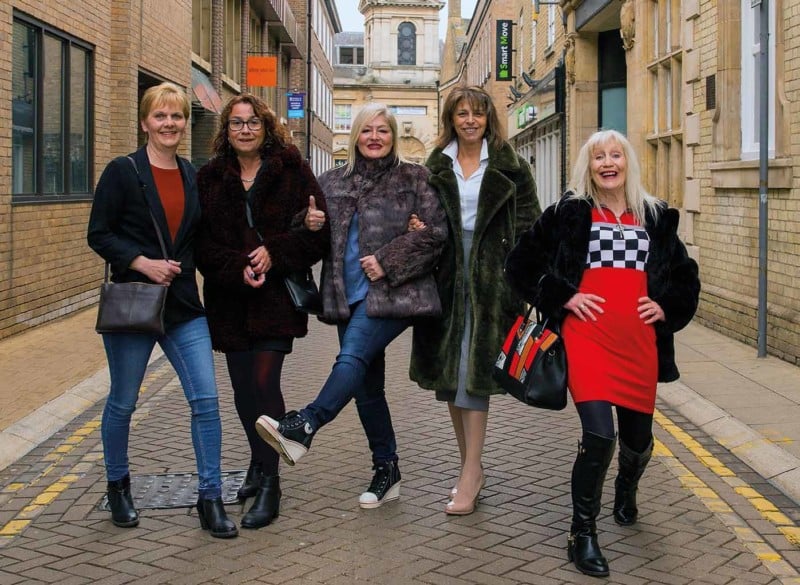 A group of older women on a street