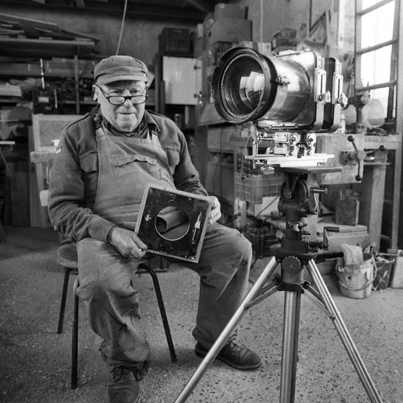 A man sitting with a large format camera