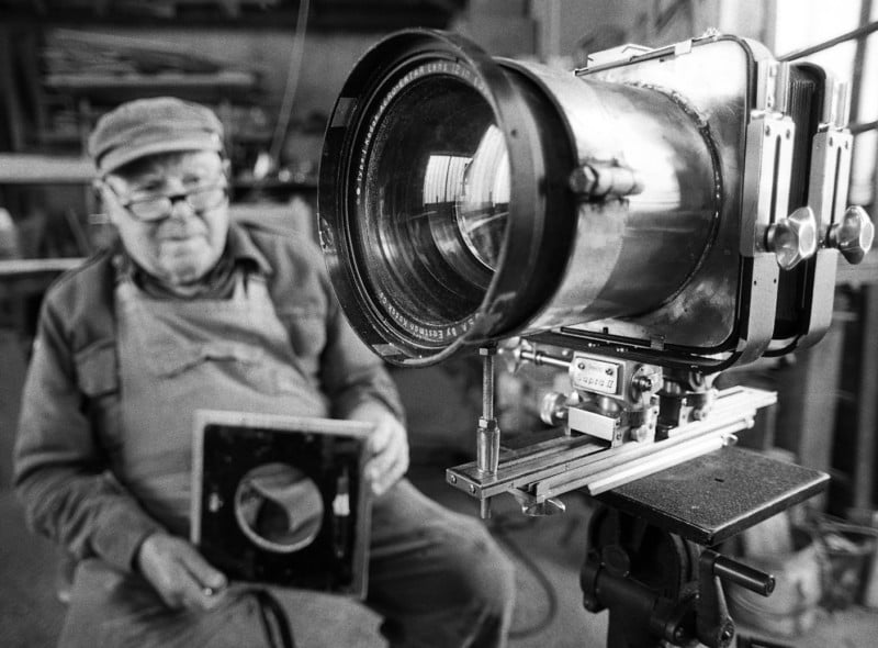 A man sitting with a large format camera