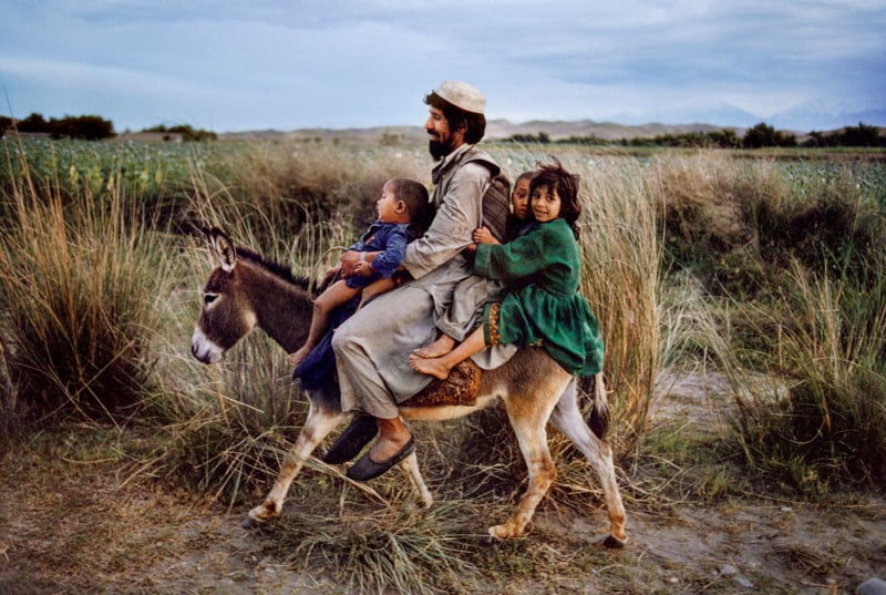 00094_15, Maimana, Afghanistan, 2003, AFGHN-12369. CAPTION: Family Rides a Donkey. Maimana, Afghanistan, 2003. MAX PRINT SIZE: 30X40 IG: This father in Northern Afghanistan takes his children home from a trip to the market.​ 01/08/2015 - ARCHIVED 01/01/2017 - ARCHIVED There is evidence that this ancient town was inhabited as early as the 12th century BCE. MCS2003005K102, NYC65651 final print_perugia final print_MACRO final print_Sao Paulo Fine Art Print A Life in Pictures_Bonnie Book Final Select PG. 83 final print_Animals (PG. 32) Animals_book retouched_Sonny Fabbri 03/09/2017, Sam Wallander 5/15/2018, Frank Carbonari 11/12/2018