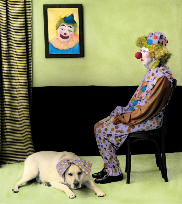 A clown sitting in a green room