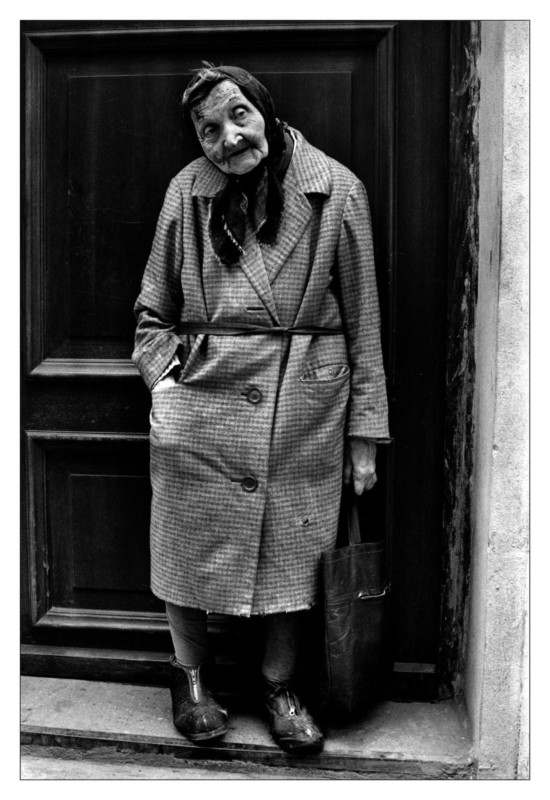 A street photo of an old lady by Sabine Weiss