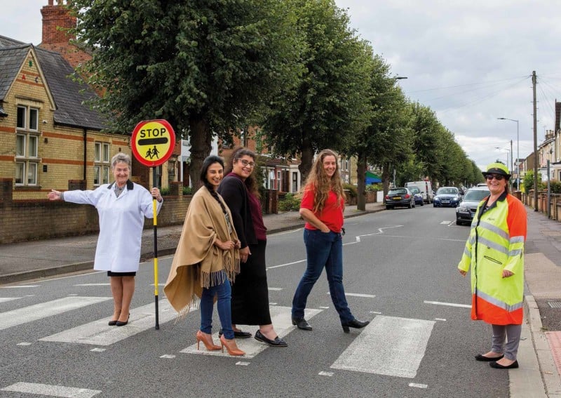 A group of women crossing a street