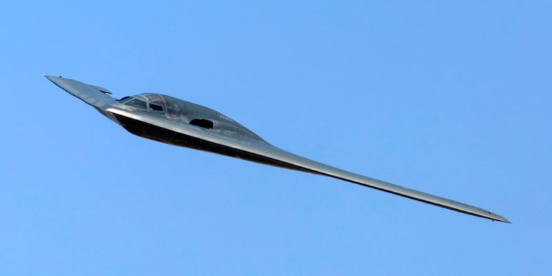 A photo of a B-2 stealth bomber in mid-flight