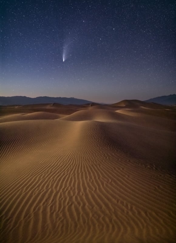 Comet NEOWISE over moonlit sand dunes