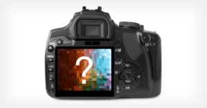 A digital camera with a question mark on the screen