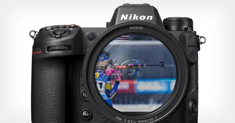 A Nikon Z9 mirrorless camera with a reflection of a biathlon athlete shooting a rifle in the lens