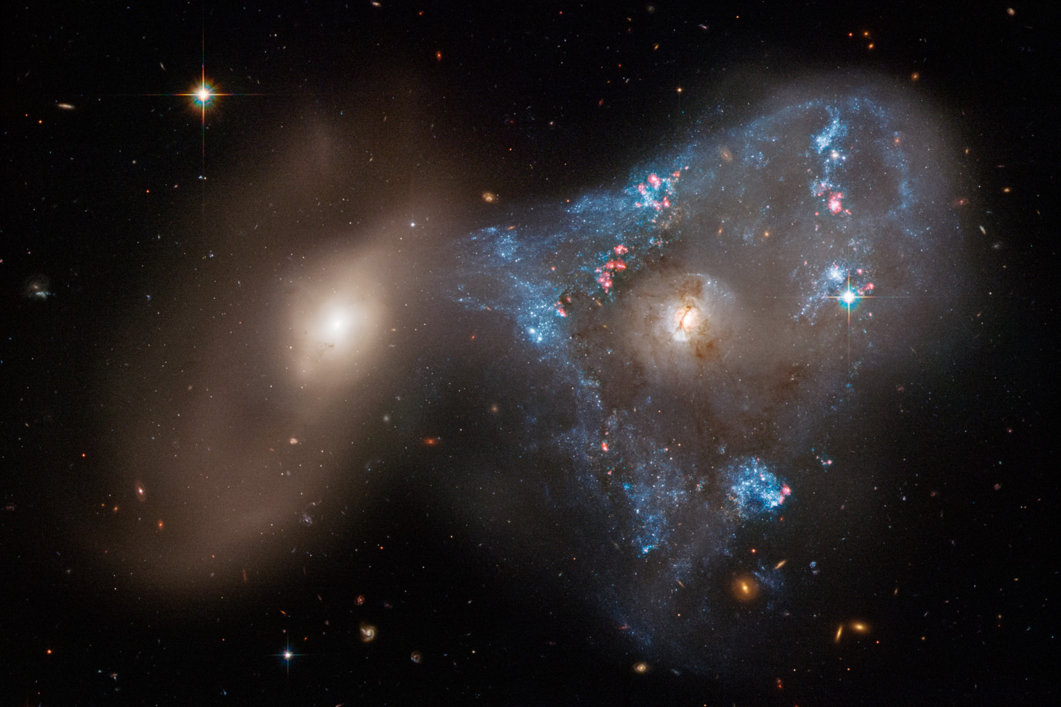 Hubble Captures 'Space Triangle' Created By Colliding Galaxies | PetaPixel