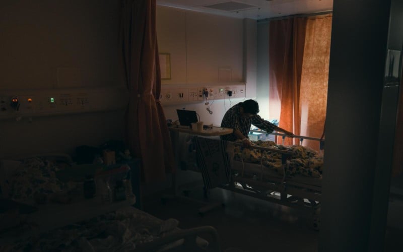 A patient in a bed in Hong Kong's COVID hospital isolation