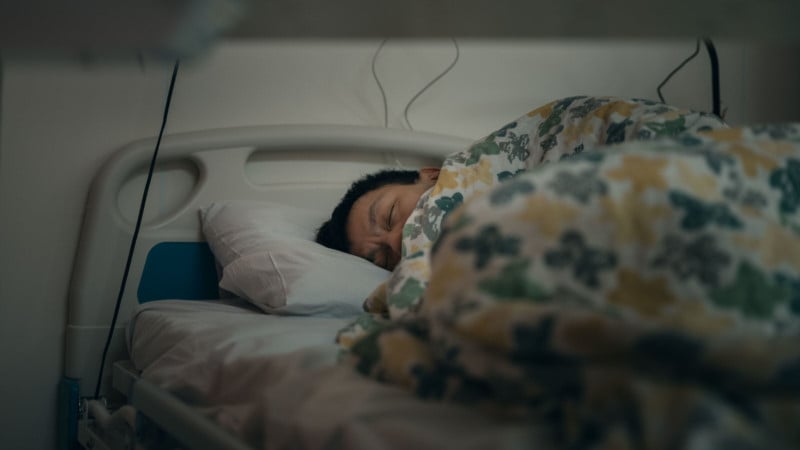 A patient sleeping in Hong Kong's COVID hospital isolation