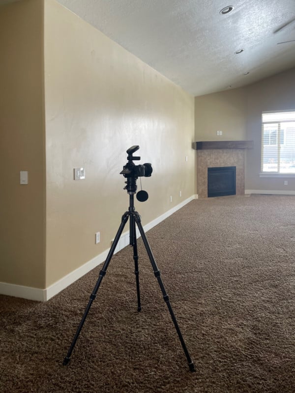 A camera on a tripod in a house