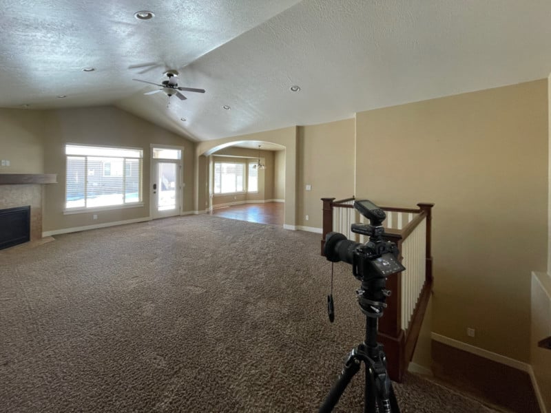 A camera and tripod ready to shoot a real estate photo
