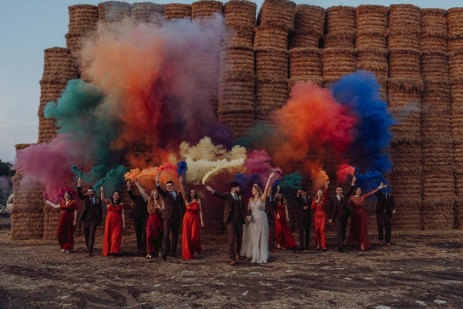 A wedding party with colorful smoke bombs
