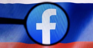 facebook logo over russian flag