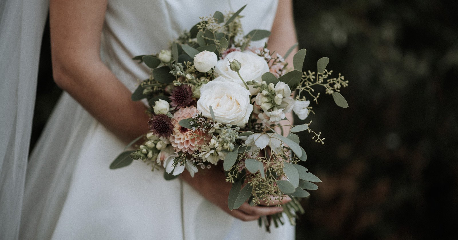 A bride holding a flower bouquet