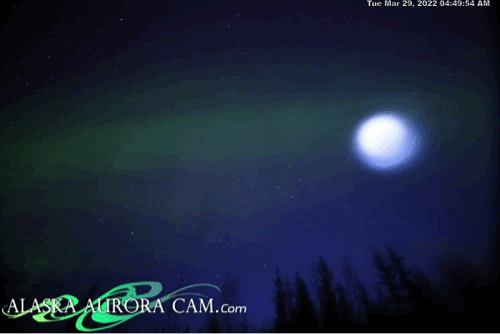 the orb appears above the Alaskan aurora