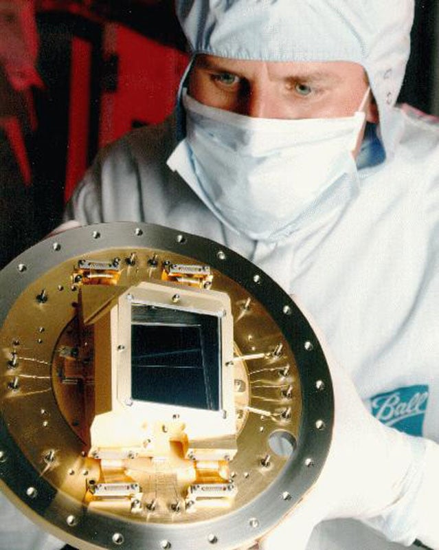 Technician holding the ACS CCD camera.
