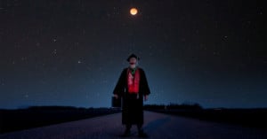 Graduation photo under a lunar eclipse