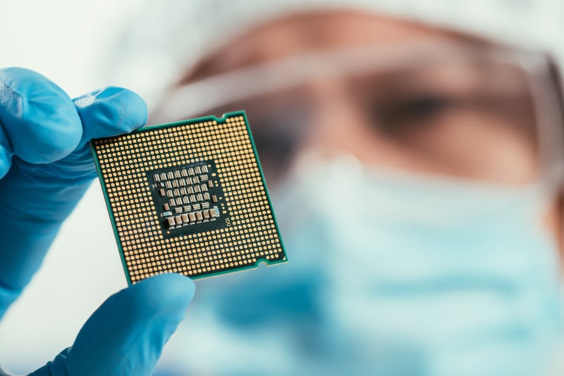 scientist holds a computer chip