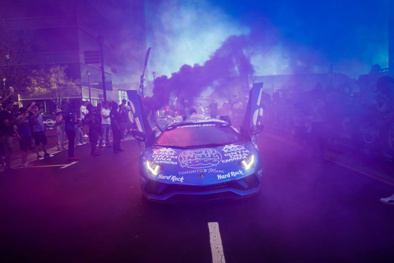 A car with flares going off during the Gumball 3000 rally