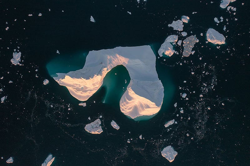 Aerial view of iceberg collapse in Greenland