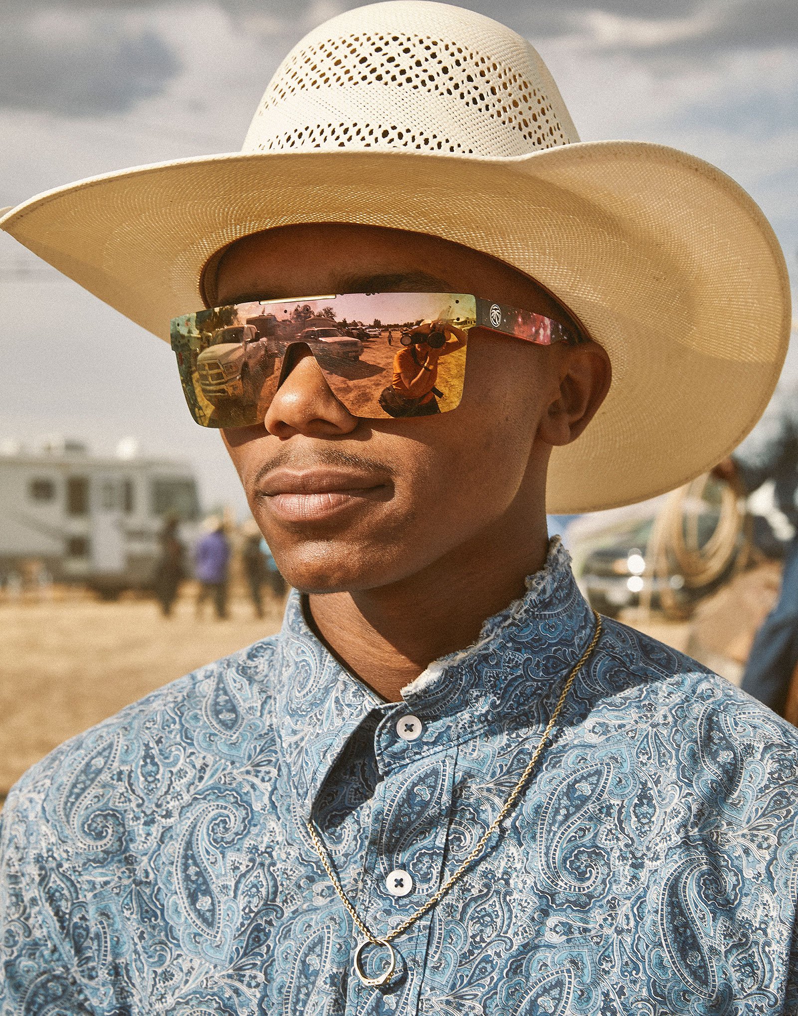 young man in futuristic shades and cowboy hat