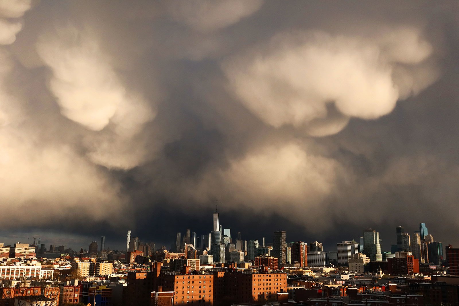 NYC skyline with dark storm clouds above